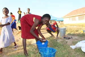 A girl doing her wash at an African boarding school.